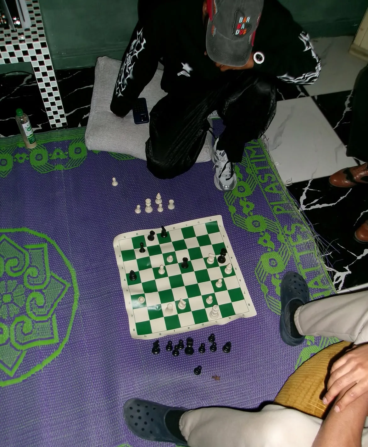 A chess game on a purple table